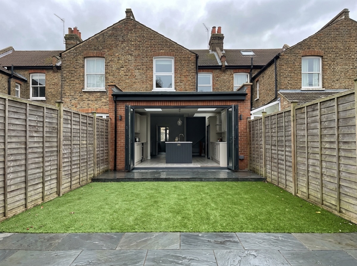 Single storey rear extension exterior with bi-fold doors open to garden